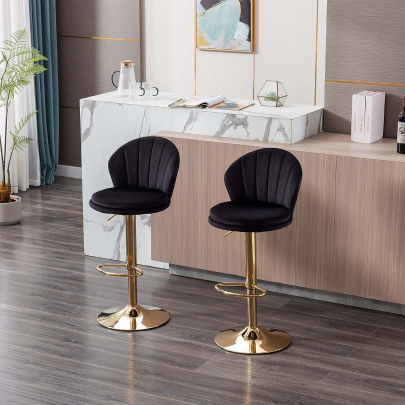 Lifestyle image of the black velvet swivel bar stool in a modern kitchen setting.