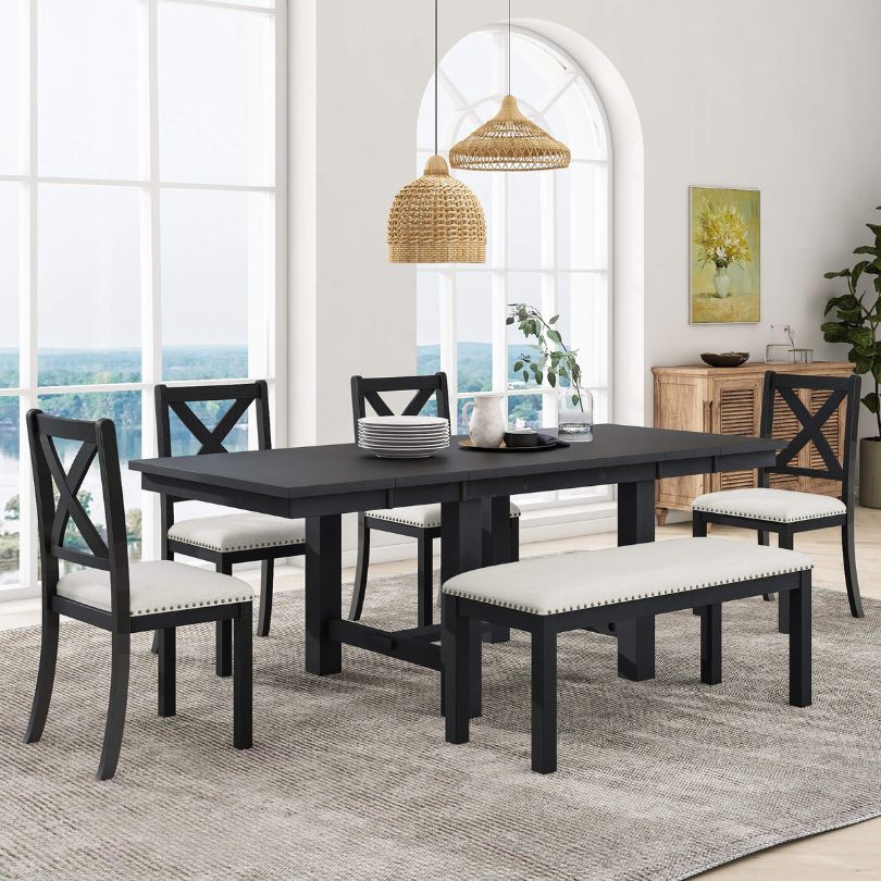 Elegant black and beige farmhouse dining set showcasing the spacious table and upholstered chairs.