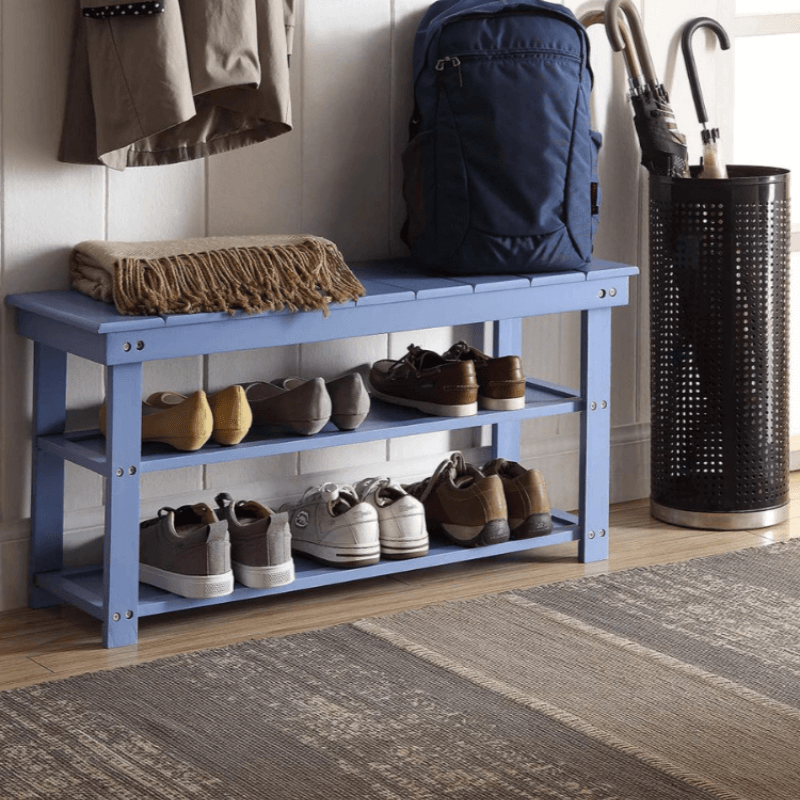 Coastal Blue Mudroom Bench with Shelves in a bright entryway, showcasing its slatted seat and lower storage.