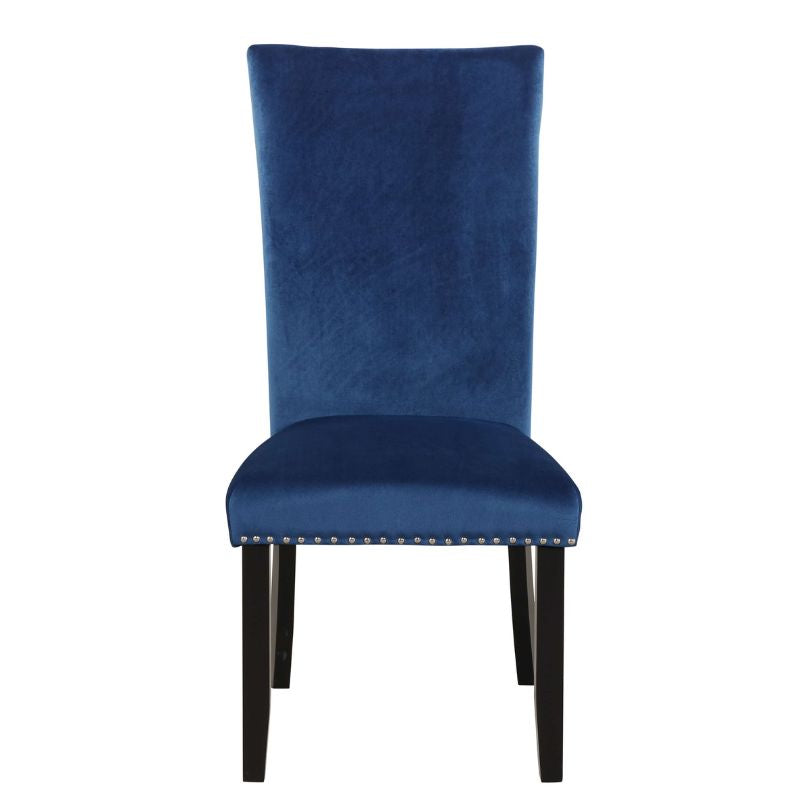 Luxurious blue velvet dining chair set on display in a contemporary dining room.