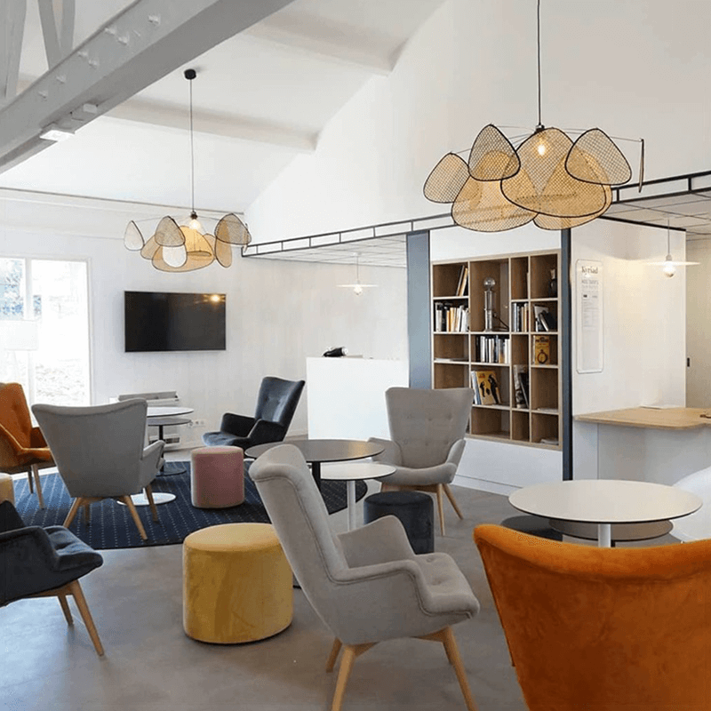 Stylish rattan light illuminating a cozy interior space, perfect for dining areas.