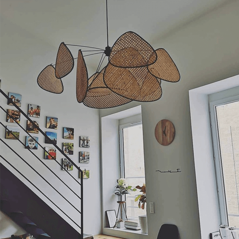 Stylish rattan light illuminating a cozy interior space, perfect for dining areas.