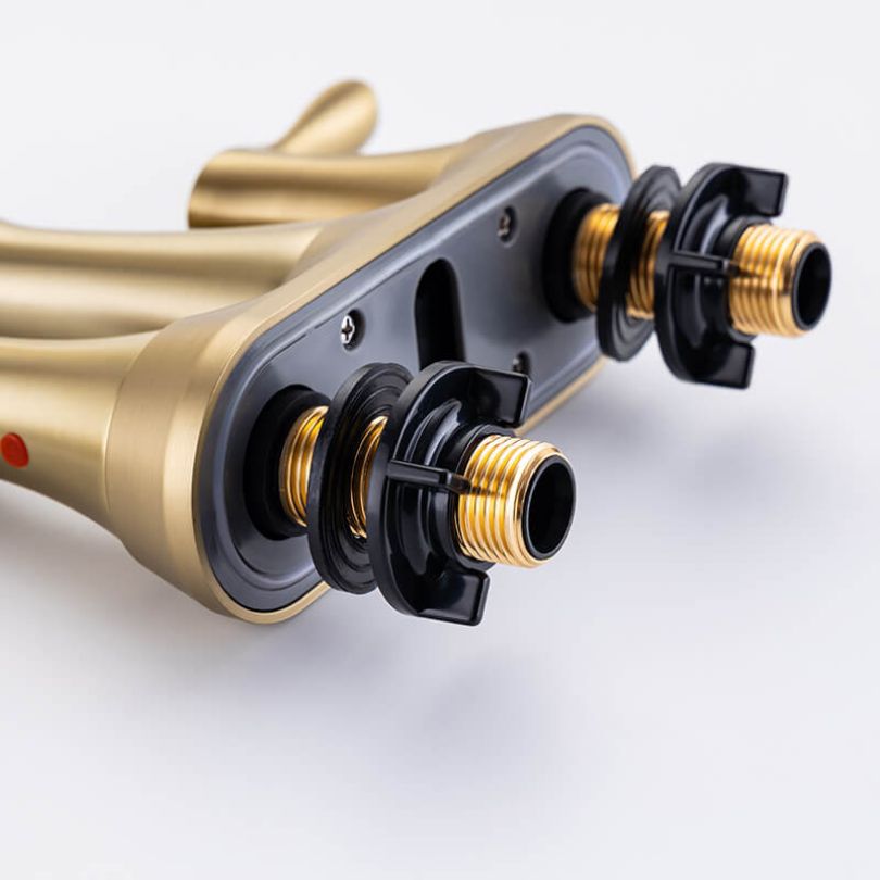 Brushed gold bathroom faucet with swivel spout from a side angle