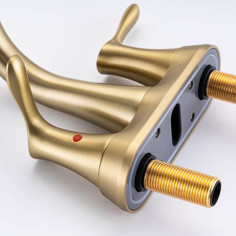Brushed gold bathroom faucet with swivel spout from a side angle