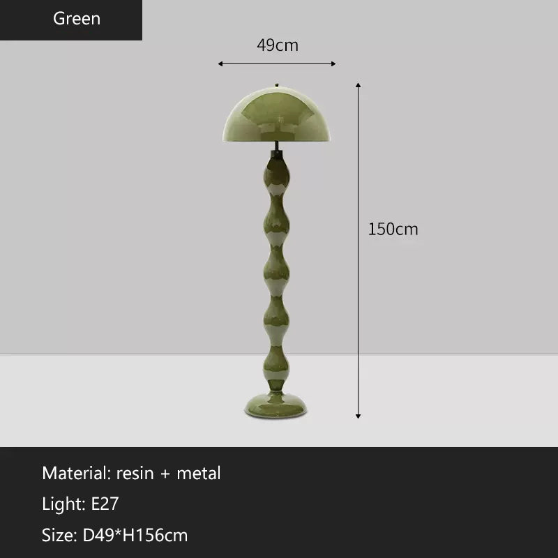 Contemporary minimalist LED mushroom floor lamp in a cozy living room corner.