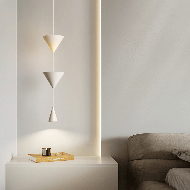 Installation of the cone-shaped LED pendant light above a stylish bar area.