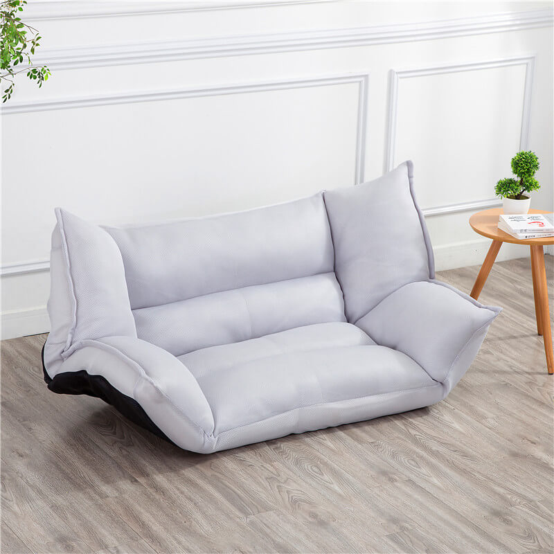 Close-up of the sofa beds fabric texture, highlighting its modern design and comfort.