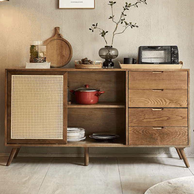 Close-up of the handcrafted rattan doors on the cane credenza, highlighting the intricate design.