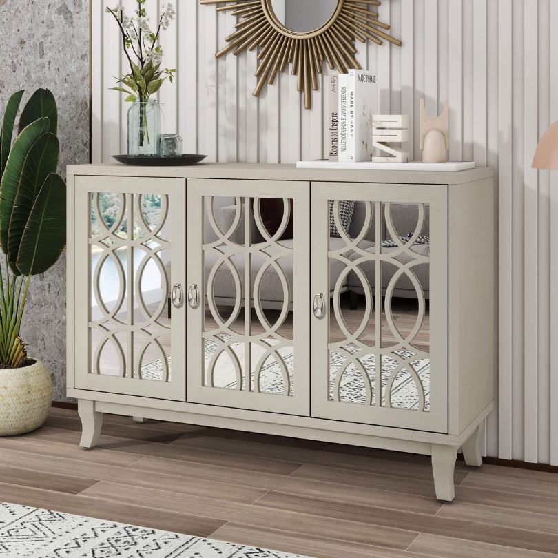Elegant champagne gold sideboard in a dining room setting, featuring stylish decor and ample storage.