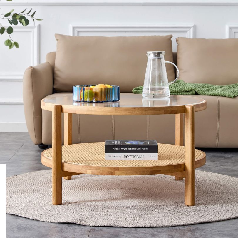 Double-layer coffee table in a living room setting, displaying various decor items.