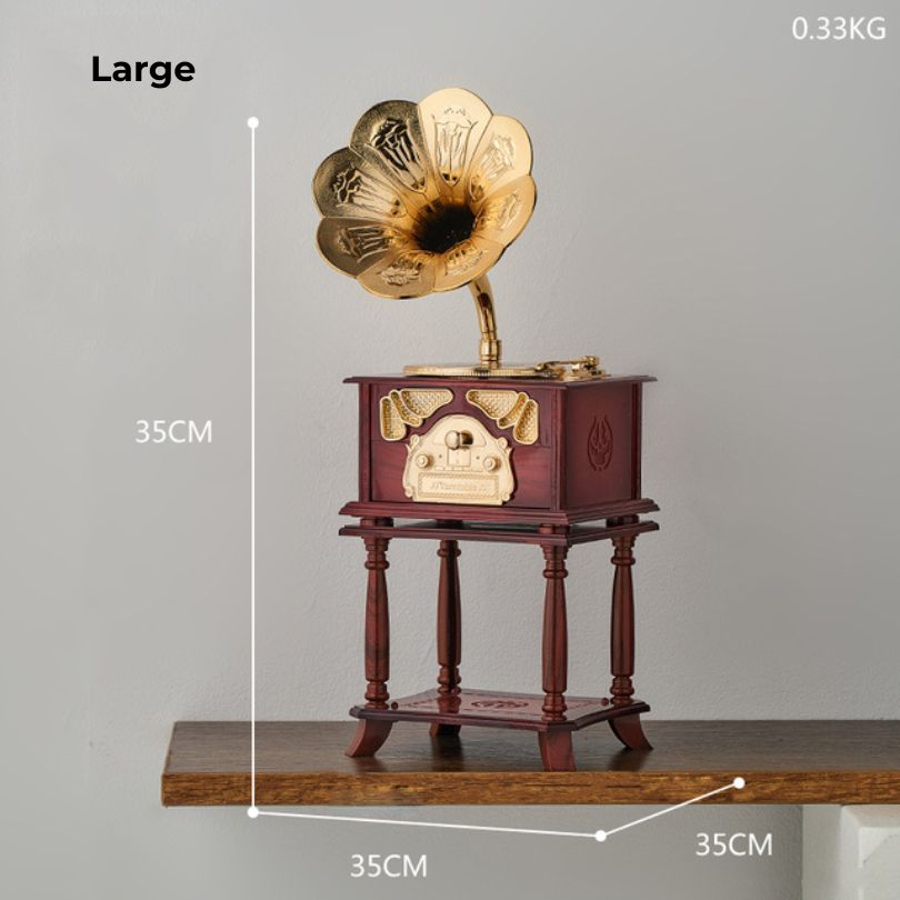 Vintage phonograph music box figurine showcasing intricate details and craftsmanship, perfect for home decoration.