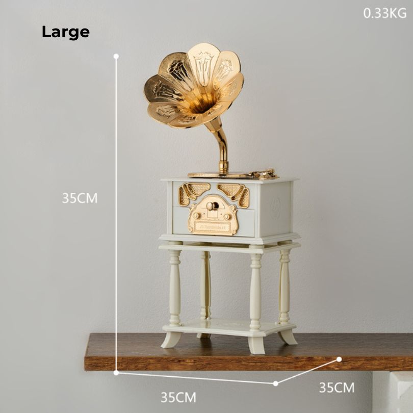 Phonograph music box figurine displayed on a shelf, enhancing the overall aesthetic of the living space.