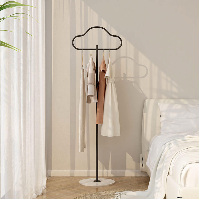 Stylish cloud-shaped coat rack in a modern entryway, showcasing its marble base and design.