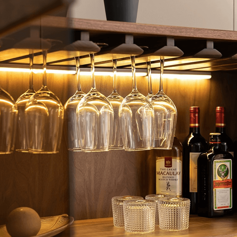 Front view of modern solid wood wine cabinet with shelves and lights.
