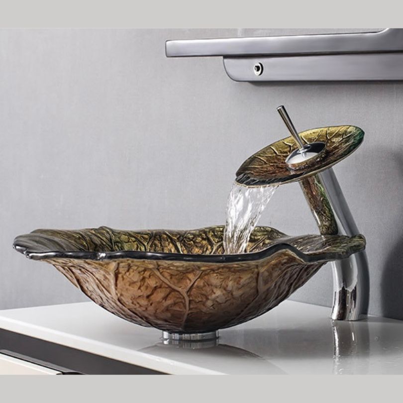 Lifestyle image of the lotus leaf sink installed on a marble vanity, surrounded by spa-inspired decor