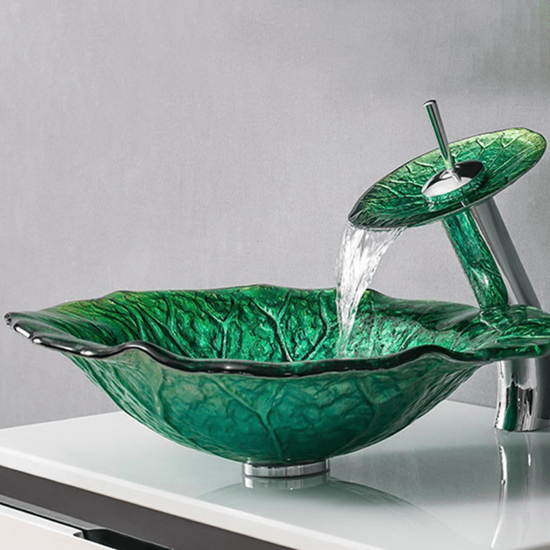 Top-down view of the luxury sinks featuring the dark green lotus leaf sink in a modern bathroom