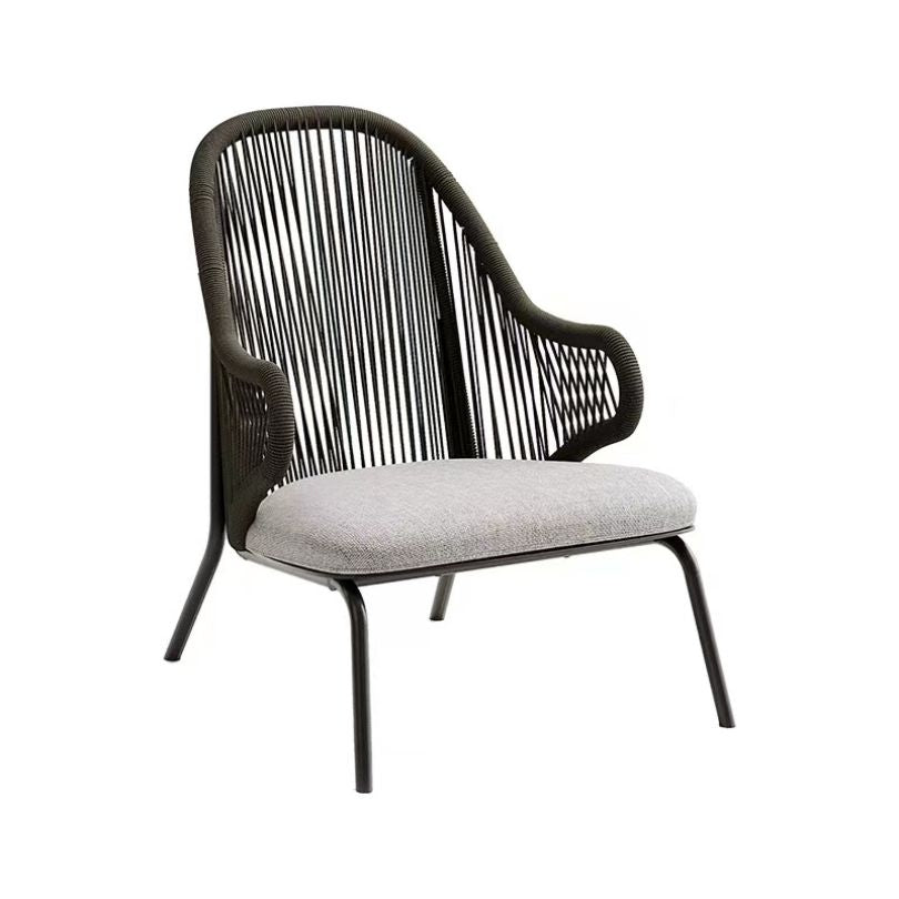 Modern outdoor leisure chair with footstool in a stylish patio setting.