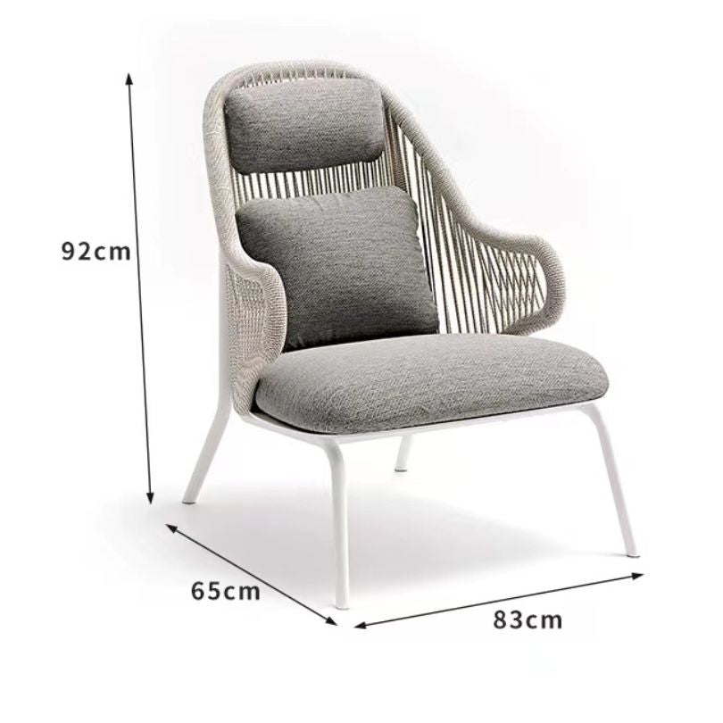 Modern outdoor leisure chair with footstool in a stylish patio setting.