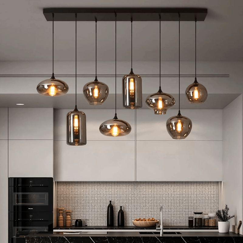 Adjustable smoked glass hanging lights illuminating a contemporary cafe.