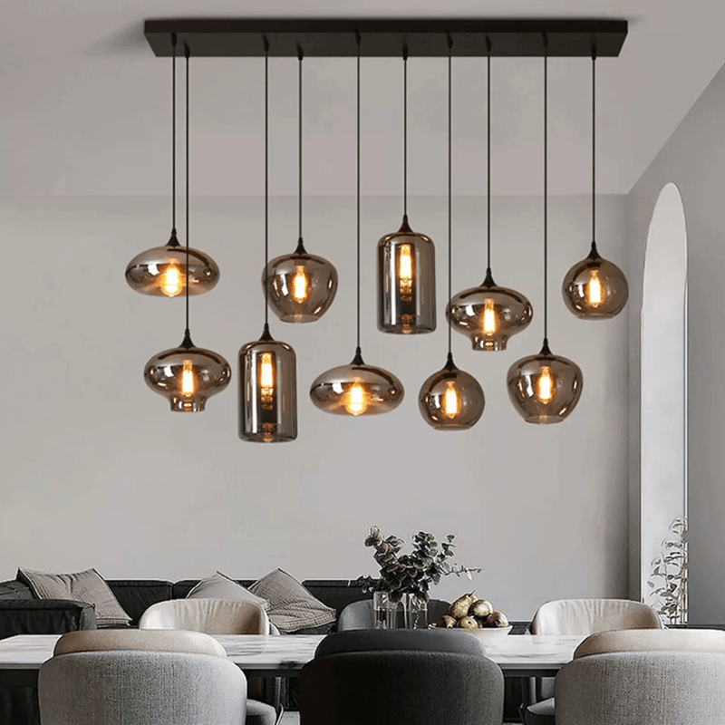 Modern smoked glass bubble pendant lights hanging in a stylish dining room.