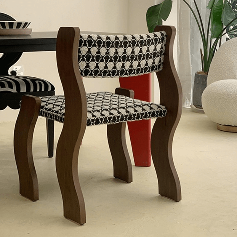 Close-up of the solid wood frame and plush cushion of the dining chair.