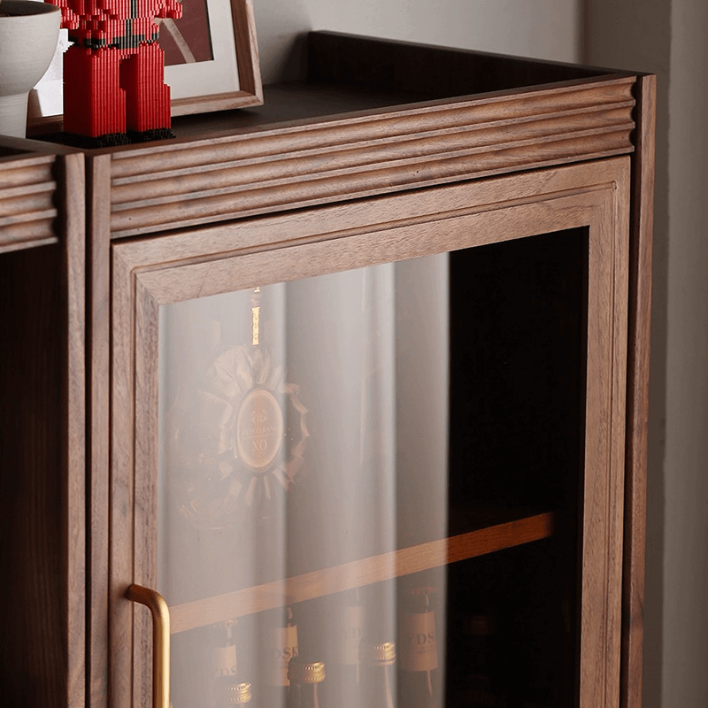 Side angle of the tall wine cabinet displaying its drawers and overall height in a contemporary living room.