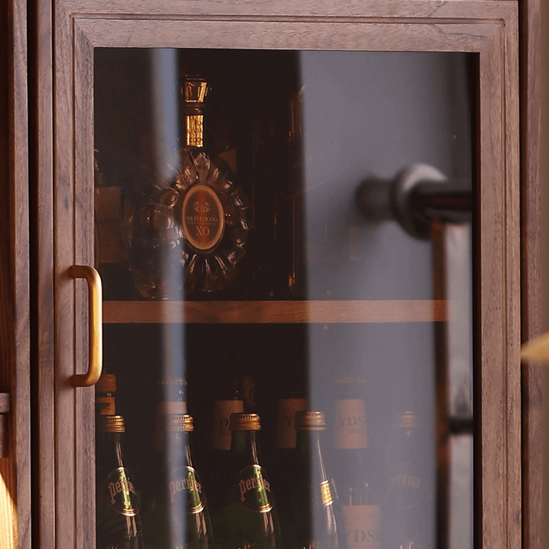 Close-up view of the tall wine cabinets walnut finish, highlighting its modern design and spacious shelves.