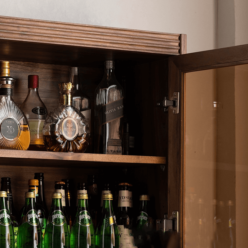 Elegant walnut tall wine cabinet showcasing wine bottles and glassware in a stylish home bar setting.