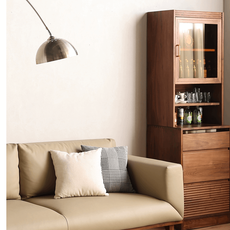 Side angle of the tall wine cabinet displaying its drawers and overall height in a contemporary living room.