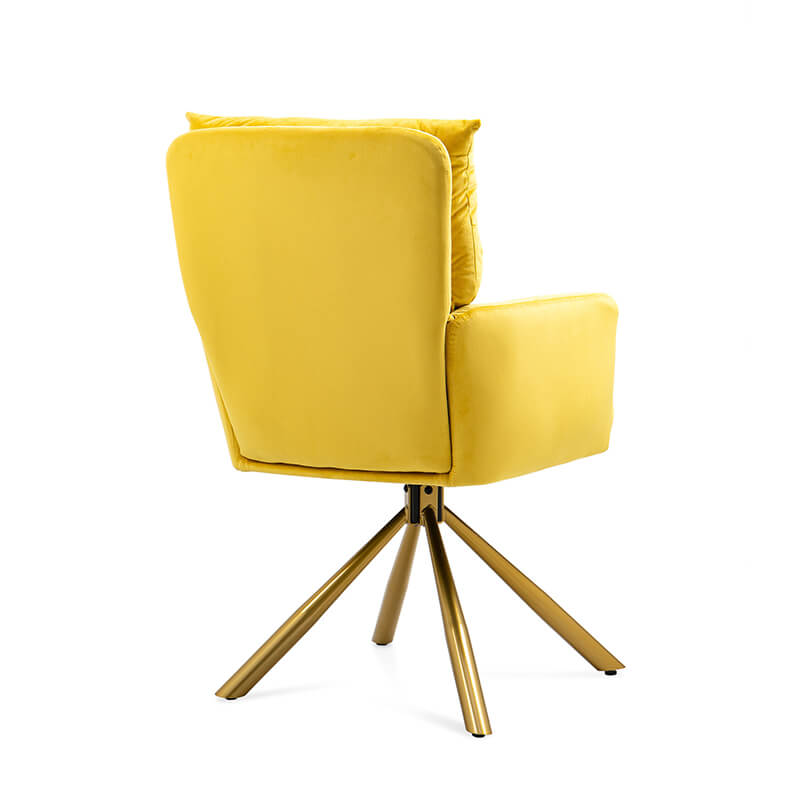 Elegant yellow velvet swivel accent chair placed in a cozy living room, highlighting its modern style.