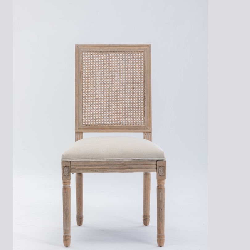 Close-up of rattan chair backrest with piped fabric and foam padding