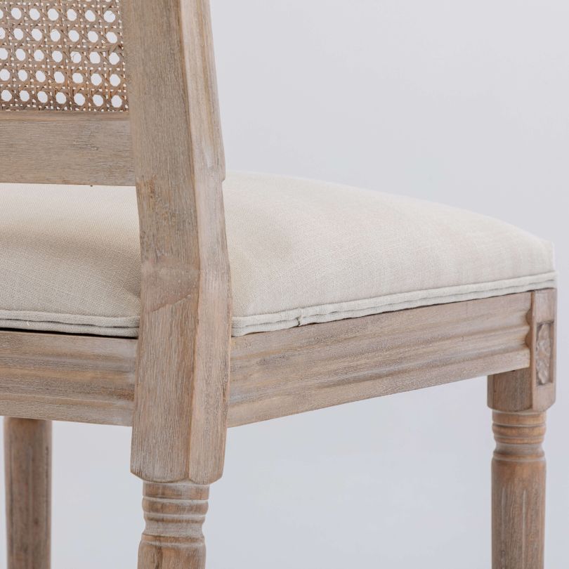 Side profile of dining chair highlighting high back and sturdy wooden legs