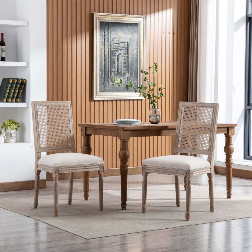 Angled view of Breeza high back chair showing beige upholstery and rattan detailing