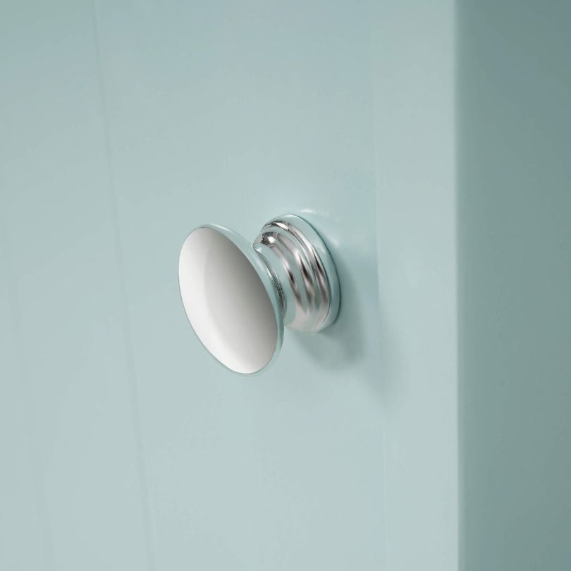 Angle showing the cabinets sleek finish and storage capacity in a stylish bathroom.