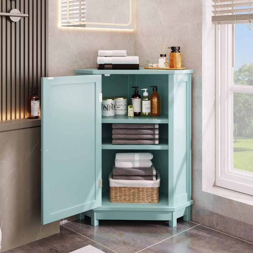 Close-up of the unique triangular design of the green corner cabinet in a modern bathroom setting.