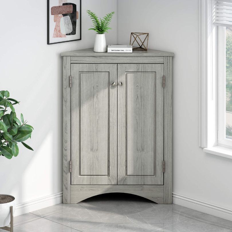 Interior view of the adjustable shelves in the corner oak cabinet, demonstrating ample storage space.