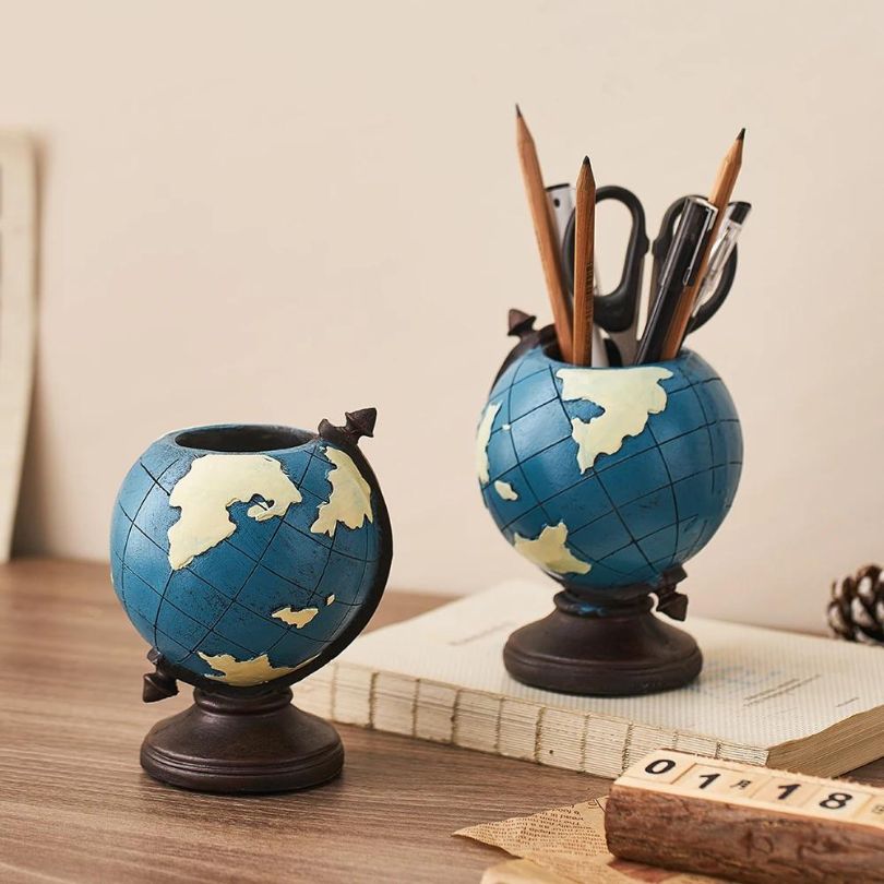 Nordic globe pen holder showcasing its bright blue color and globe design