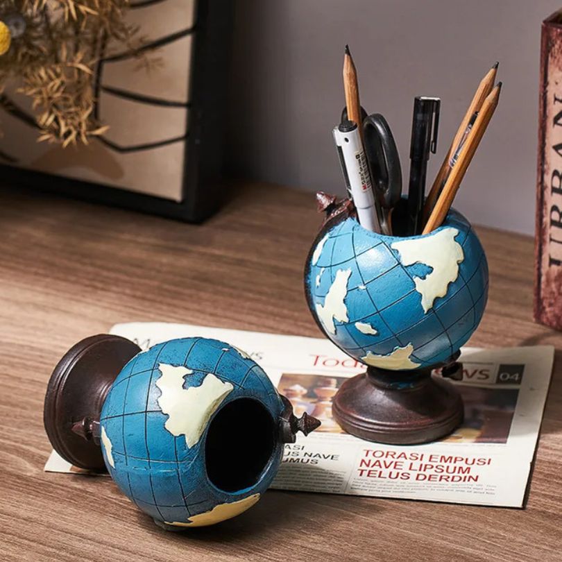 Close-up of the globe shape desktop organizer with pens and brushes