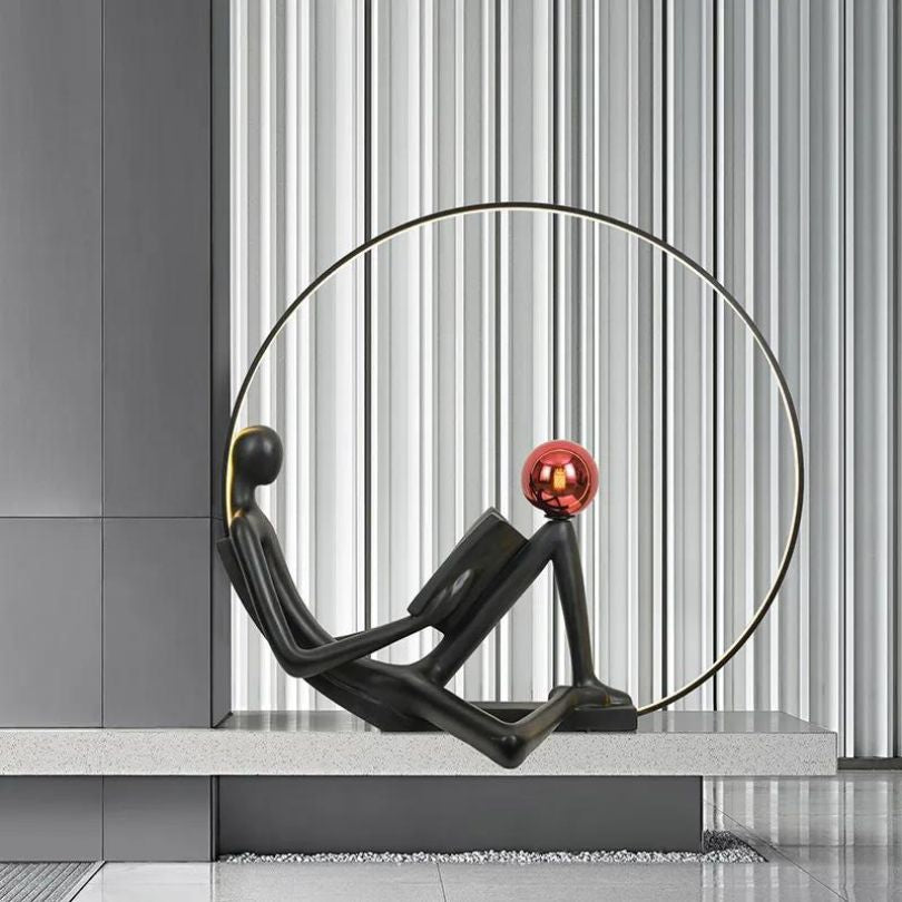 The lighted sculpture placed in a modern living room, illuminating the space with a warm glow.