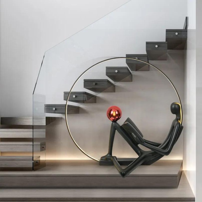 The lighted sculpture placed in a modern living room, illuminating the space with a warm glow.