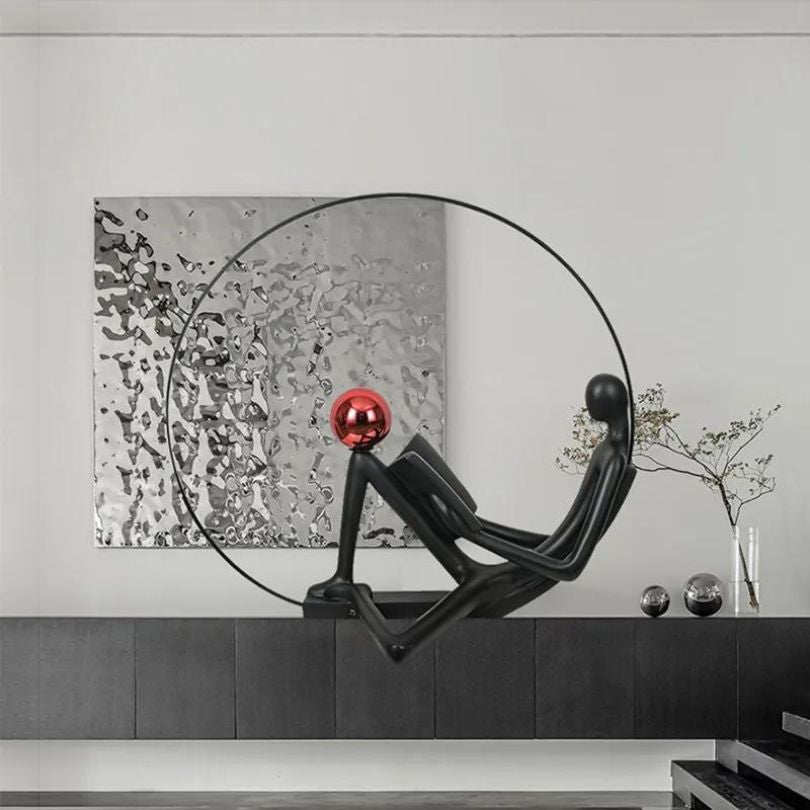 Close-up view of the black illuminated floor sculpture showcasing its unique postmodern design.