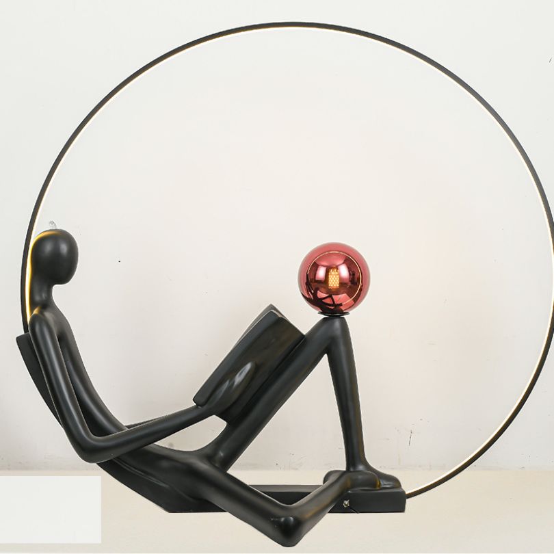Side angle of the creative floor sculpture highlighting its round shape and LED light source.