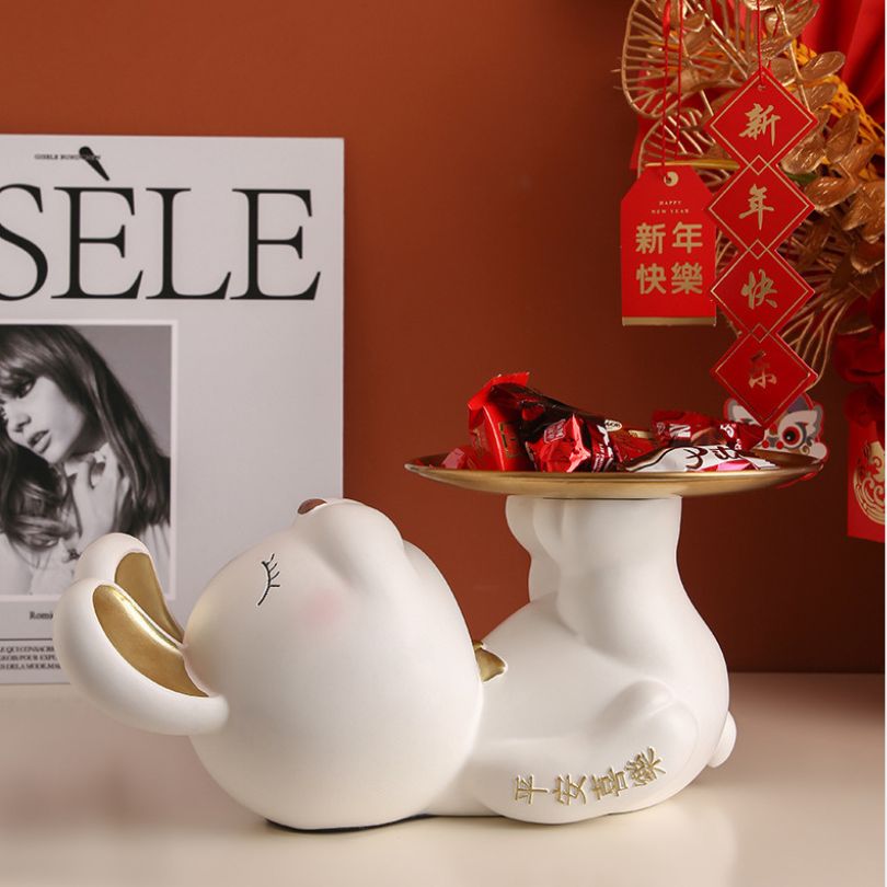 Unique phone holder for home decor featuring a modern rabbit design.