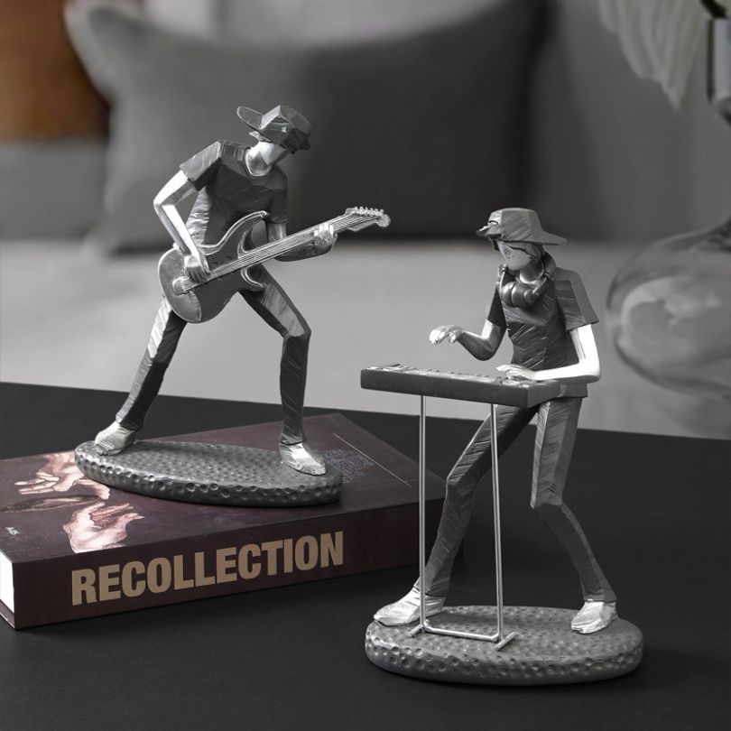 Decorative rock band figurine placed on a bookshelf, enhancing home decor.