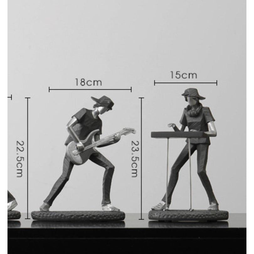 Rock band figurine on a desk, showcasing vibrant musicians.