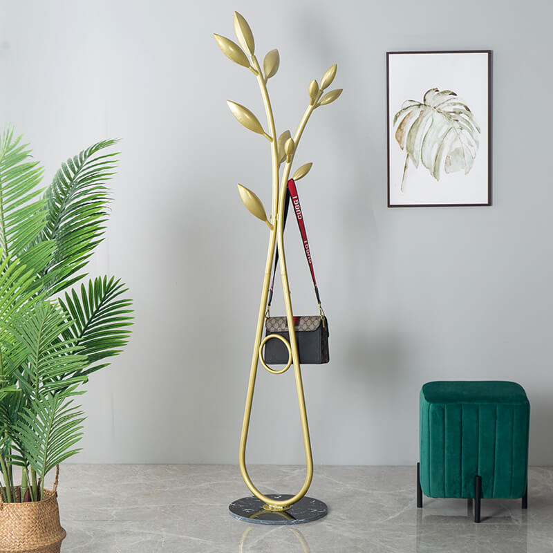 Close-up view of the tree branch hanger highlighting its elegant gold finish and multiple hooks for convenience.