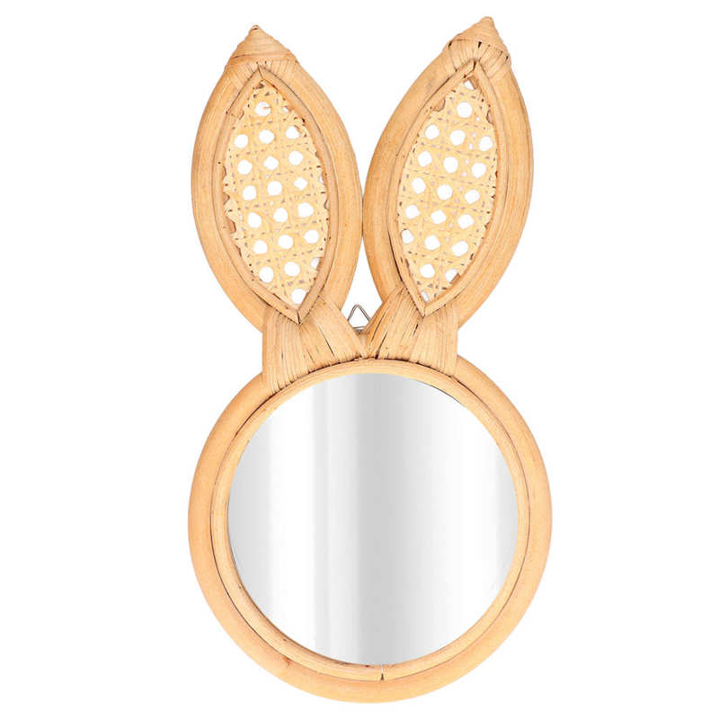 Charming bunny shape rattan wall mirror hanging in a kids' room, showcasing its playful design.