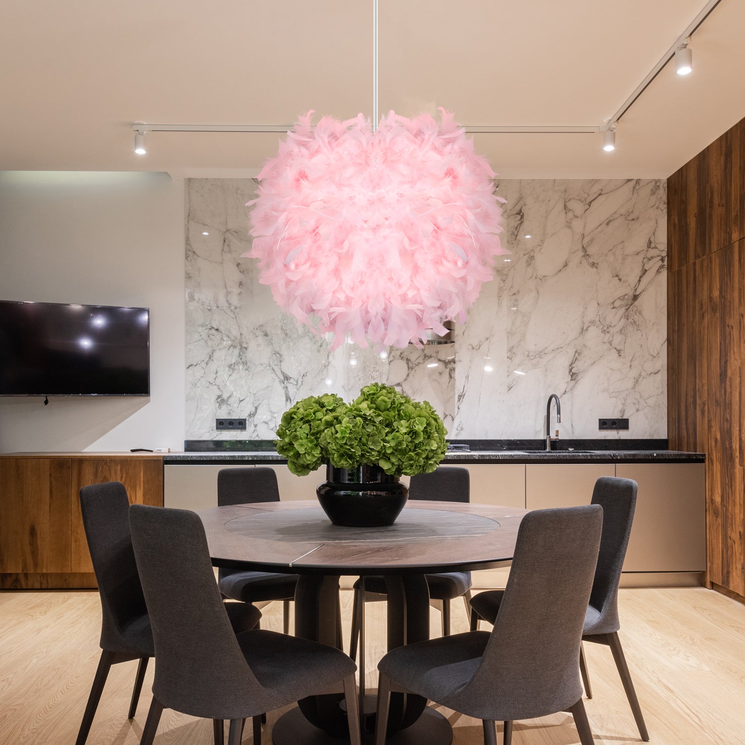 The Elegant LED Fairy Feather Pendant Light showcasing its soft glow in a cozy bedroom.
