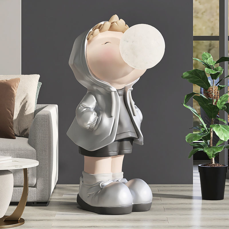 Front view of the charming cartoon boy figurine, showcasing its vibrant colors and details.
