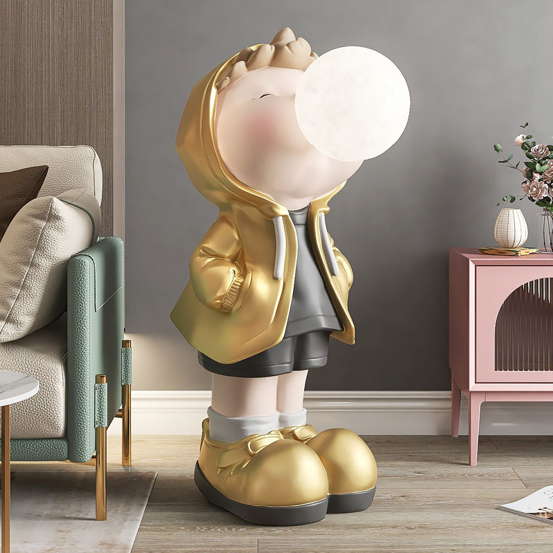 Front view of the charming cartoon boy figurine, showcasing its vibrant colors and details.